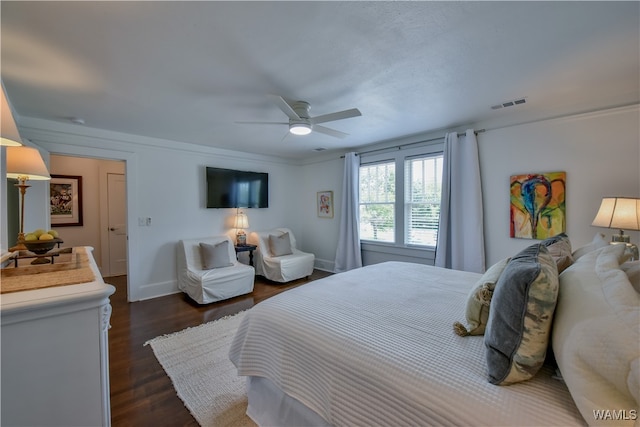 bedroom with ceiling fan and dark wood-type flooring