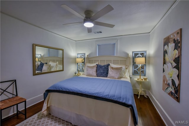 bedroom with ceiling fan, crown molding, and dark hardwood / wood-style floors