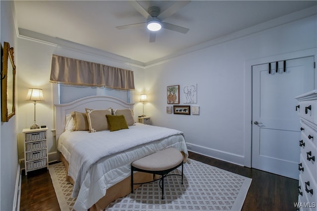 bedroom with dark hardwood / wood-style flooring, ceiling fan, and ornamental molding