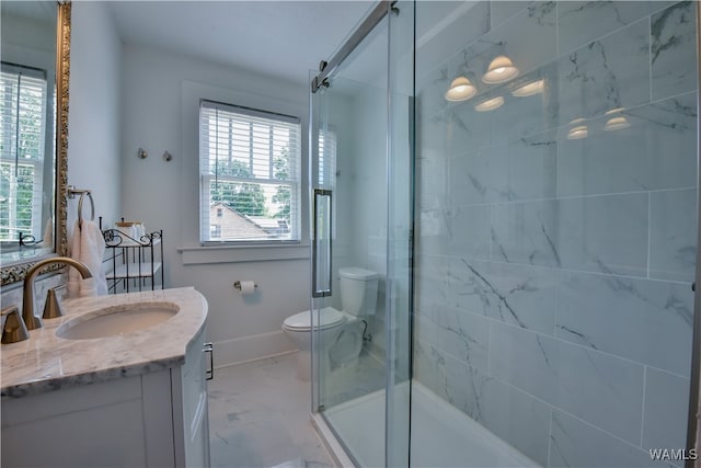 bathroom with plenty of natural light, toilet, an enclosed shower, and vanity