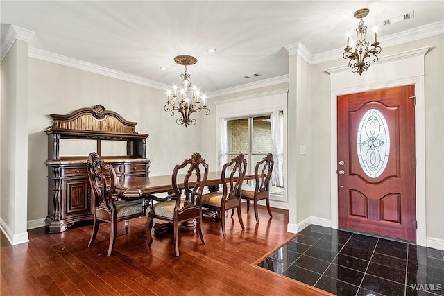 dining room with dark hardwood / wood-style flooring and crown molding