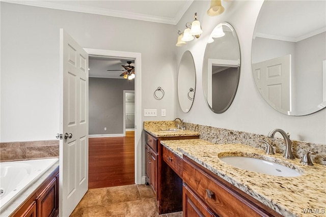 bathroom with a bathing tub, ceiling fan, crown molding, vanity, and hardwood / wood-style flooring