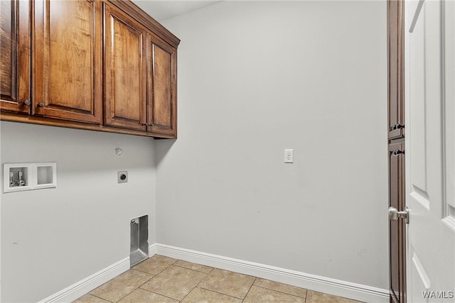 laundry room with cabinets, washer hookup, light tile patterned floors, and electric dryer hookup