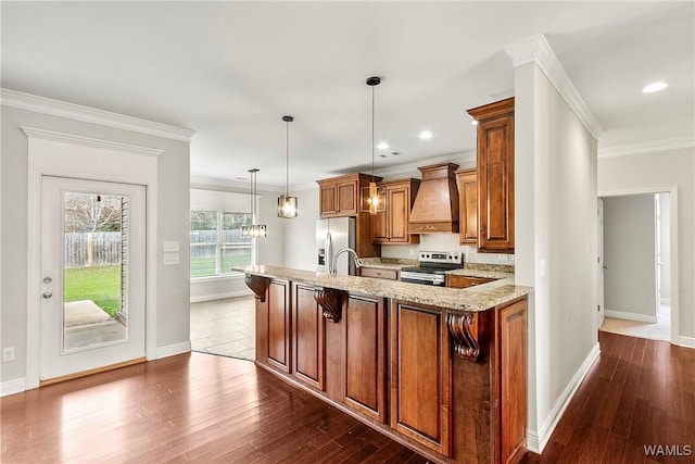 kitchen with hanging light fixtures, stainless steel appliances, dark hardwood / wood-style floors, and custom exhaust hood