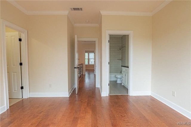 890 Founders St, Tuscaloosa, AL 35406 - unfurnished bedroom featuring wood finished floors, crown molding, and ensuite bath