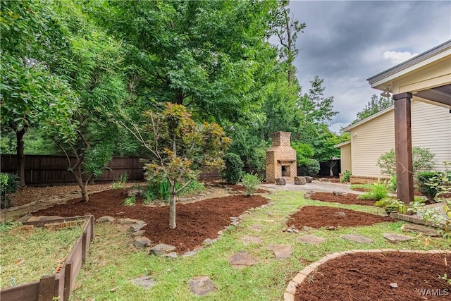 890 Founders St, Tuscaloosa, AL 35406 - view of yard featuring exterior fireplace and a patio