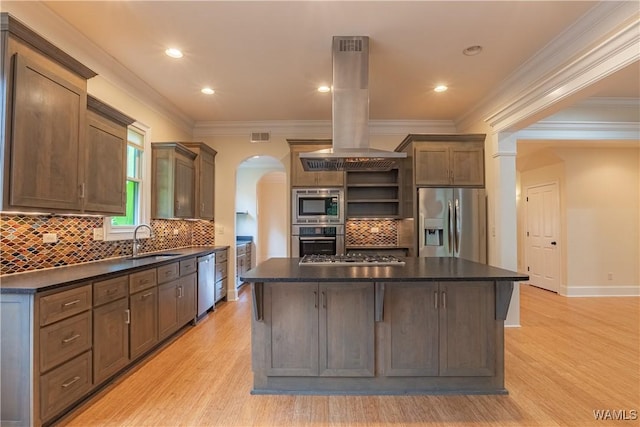 890 Founders St, Tuscaloosa, AL 35406 - kitchen featuring appliances with stainless steel finishes, island range hood, open shelves, dark countertops, and arched walkways