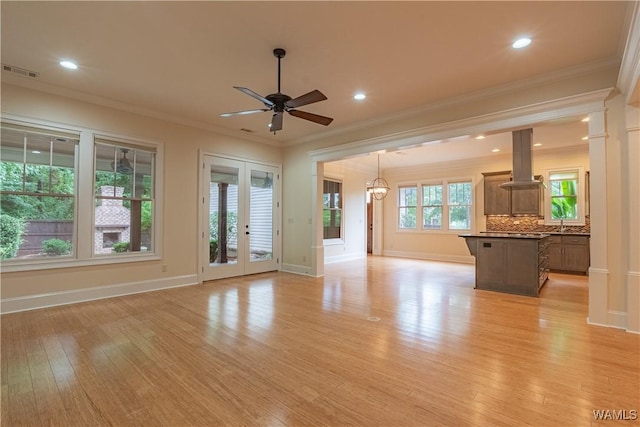 890 Founders St, Tuscaloosa, AL 35406 - unfurnished living room featuring light wood-style floors, a ceiling fan, crown molding, recessed lighting, and french doors