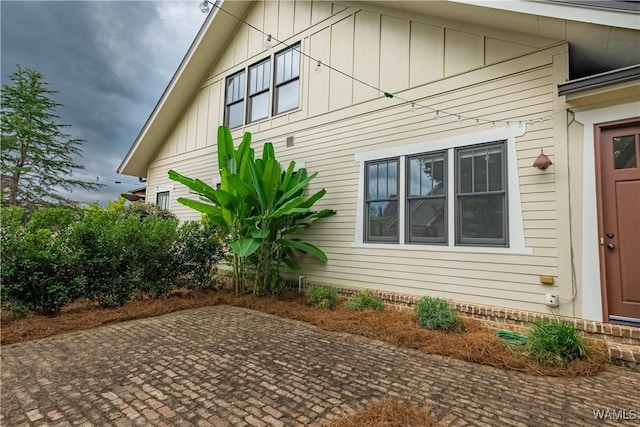 890 Founders St, Tuscaloosa, AL 35406 - view of home's exterior featuring a patio and board and batten siding