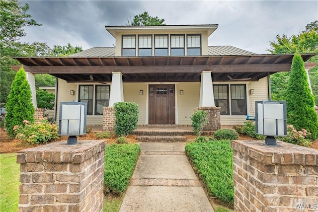 890 Founders St, Tuscaloosa, AL 35406 - view of front facade featuring covered porch, a metal roof, a standing seam roof, and brick siding