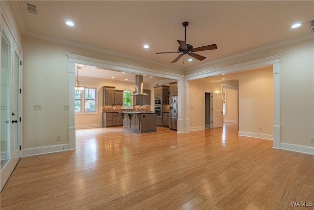 890 Founders St, Tuscaloosa, AL 35406 - unfurnished living room featuring ceiling fan, light wood-style flooring, crown molding, and recessed lighting