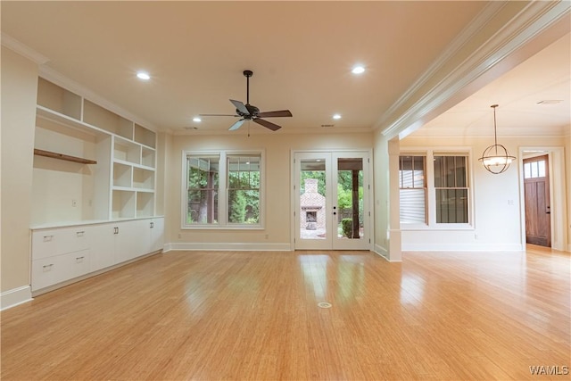 890 Founders St, Tuscaloosa, AL 35406 - unfurnished living room with ornamental molding, ceiling fan, a chandelier, light wood finished floors, and recessed lighting