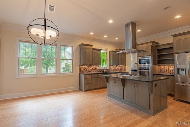 890 Founders St, Tuscaloosa, AL 35406 - kitchen with stainless steel appliances, dark countertops, open shelves, island range hood, and plenty of natural light