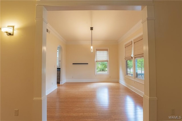 890 Founders St, Tuscaloosa, AL 35406 - unfurnished room featuring crown molding, light wood finished floors, and arched walkways