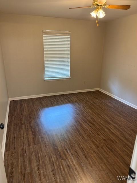 1813 Hackberry Ln Unit 10, Tuscaloosa, AL 35401 - spare room featuring dark wood finished floors and a ceiling fan