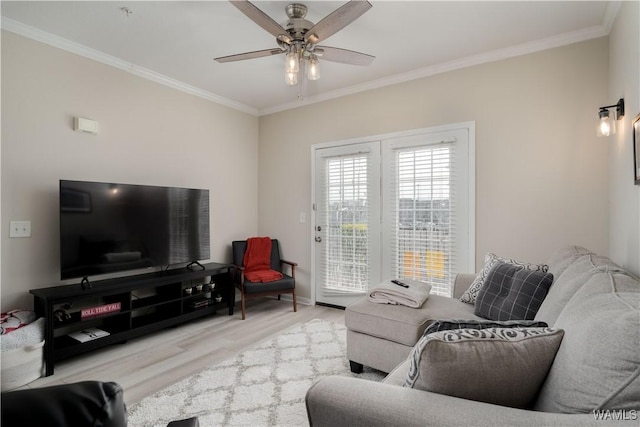 1901 5th Ave E Unit 2105, Tuscaloosa, AL 35401 - living area featuring wood finished floors, ornamental molding, a ceiling fan, and baseboards