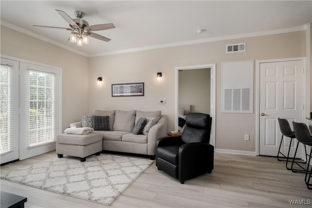 1901 5th Ave E Unit 2105, Tuscaloosa, AL 35401 - living room with ornamental molding, a ceiling fan, light wood-type flooring, and baseboards