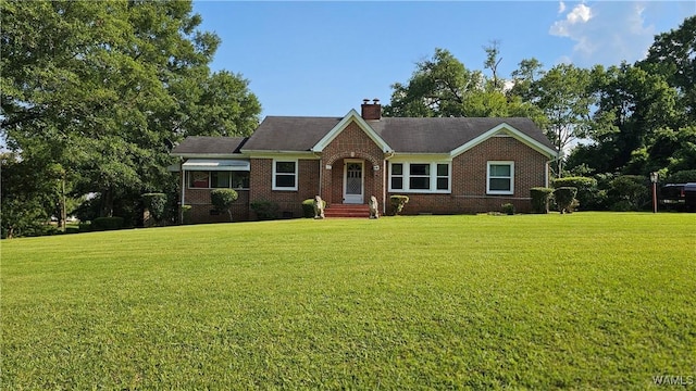 505 W Greene St, Marion, AL 36756 - view of front of house with a front yard, brick siding, crawl space, and a chimney