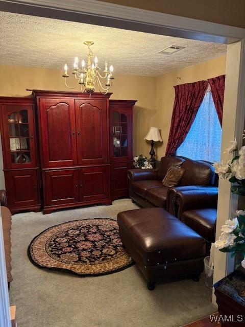 carpeted living room featuring a textured ceiling and a notable chandelier