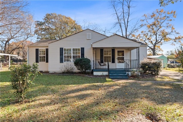 view of front of home with covered porch and a front yard