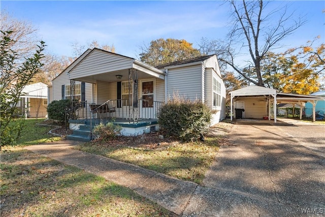 bungalow with a porch and a carport