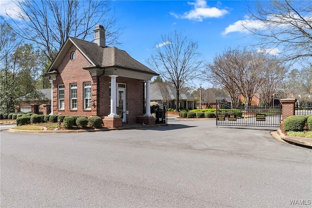 exterior space featuring a gate and fence