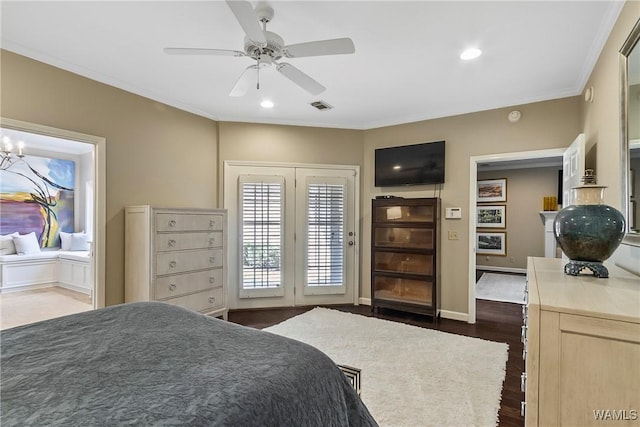 bedroom with baseboards, visible vents, dark wood-type flooring, crown molding, and recessed lighting