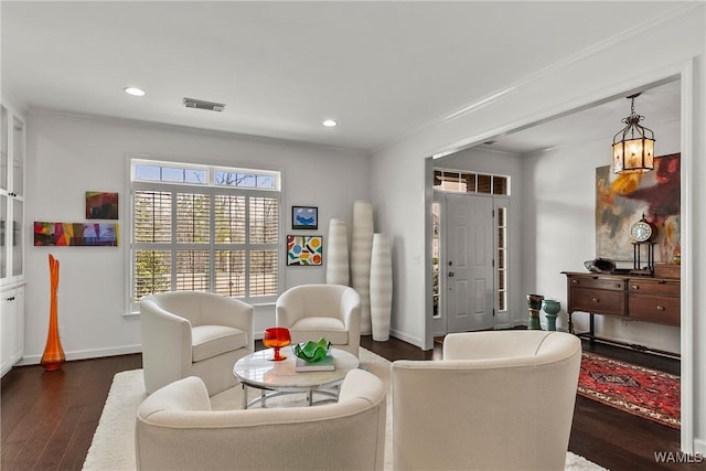 living area featuring baseboards, dark wood-style flooring, recessed lighting, and crown molding