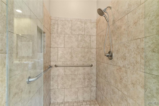 bathroom with a shower stall