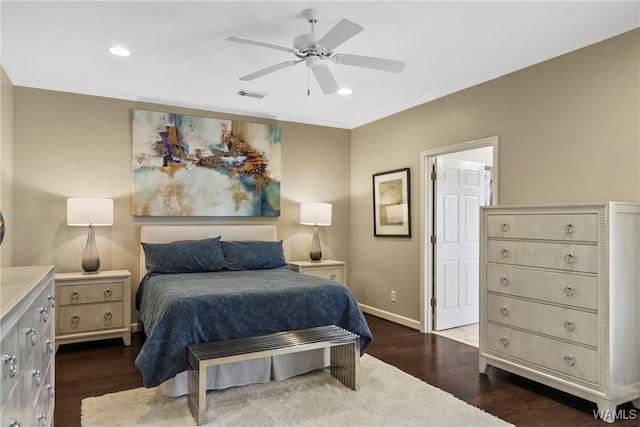 bedroom featuring recessed lighting, dark wood-type flooring, visible vents, baseboards, and crown molding