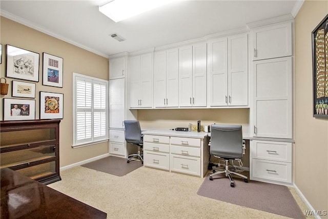 home office featuring carpet floors, visible vents, ornamental molding, and baseboards