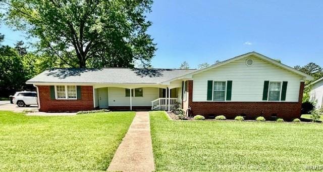 1210 Lake Ln, Demopolis, AL 36732 - single story home featuring a front yard, brick siding, and a porch