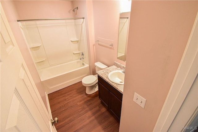 full bathroom featuring vanity, hardwood / wood-style flooring, toilet, and shower / bathtub combination