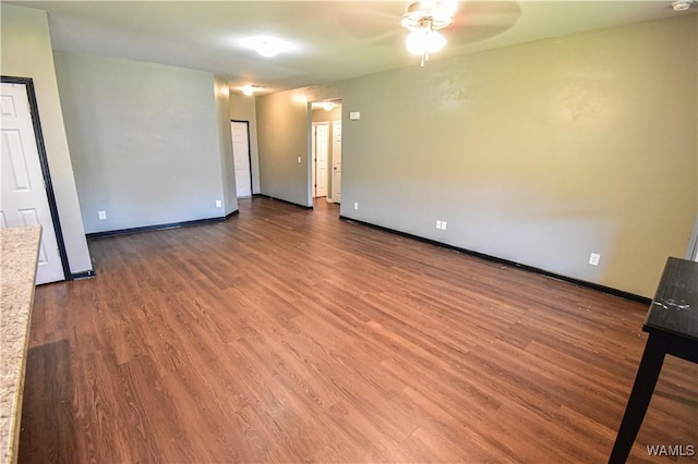 spare room featuring hardwood / wood-style flooring and ceiling fan