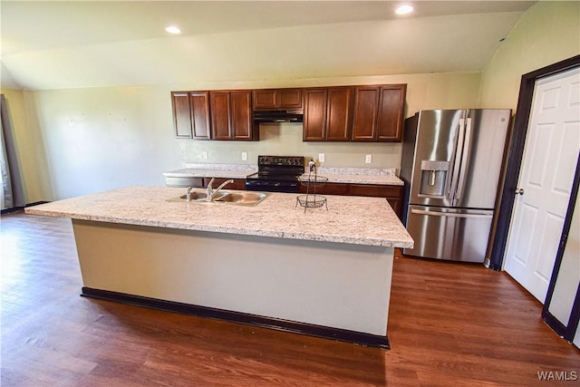 kitchen with stainless steel fridge, sink, dark hardwood / wood-style flooring, and an island with sink