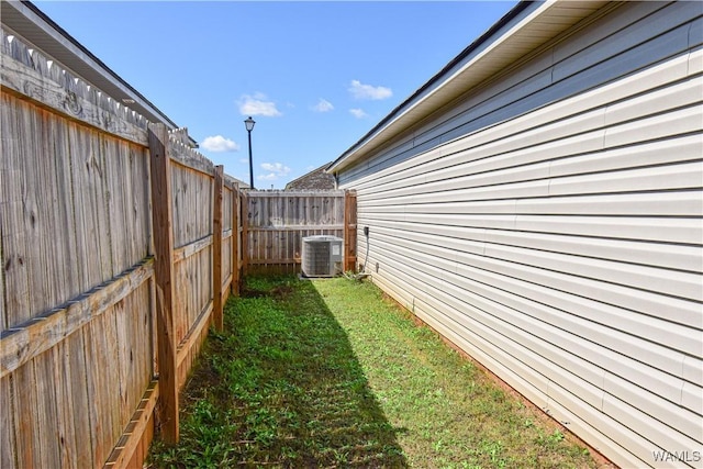 view of yard with central AC