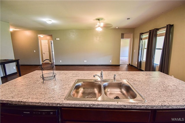 kitchen with ceiling fan, sink, a center island with sink, black dishwasher, and dark hardwood / wood-style floors