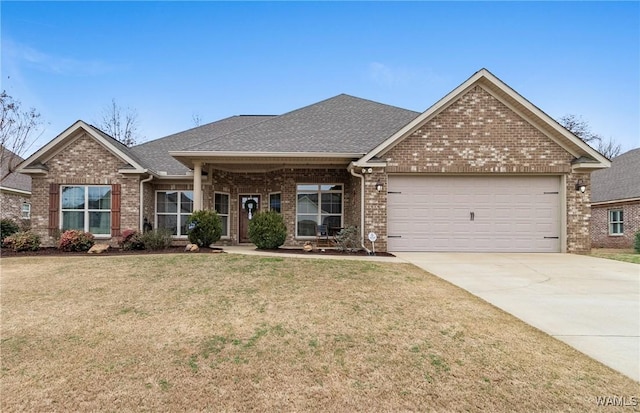 view of front of home featuring a garage and a front lawn