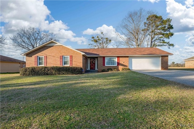 ranch-style house with a garage, a front yard, aphalt driveway, and brick siding