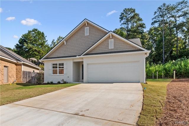 view of front of house featuring a front yard and a garage