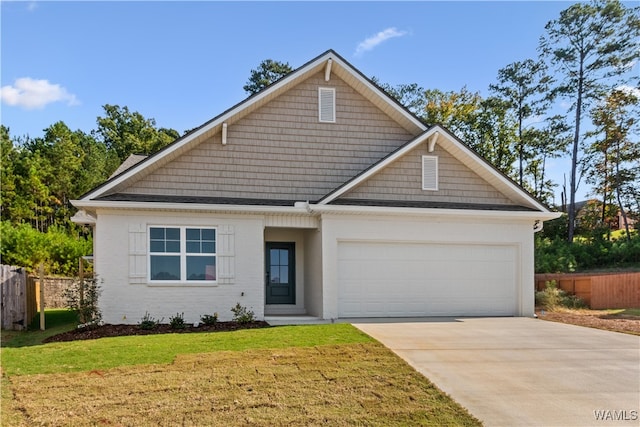 view of front of house with a garage and a front yard