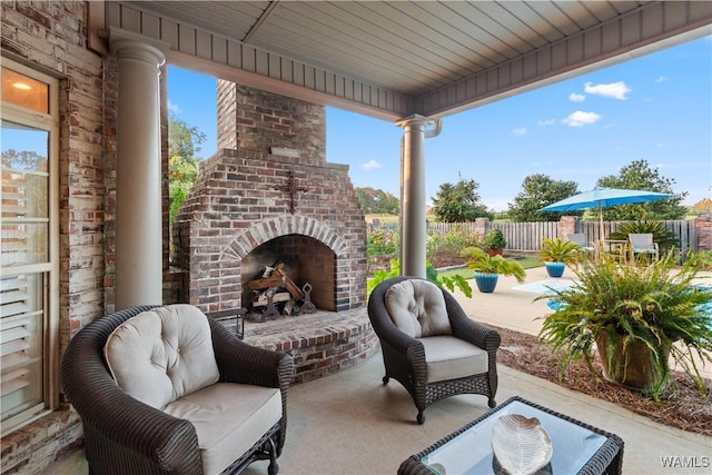 3610 Harbor Ridge Way, Tuscaloosa, AL 35406 - view of patio featuring an outdoor brick fireplace and fence