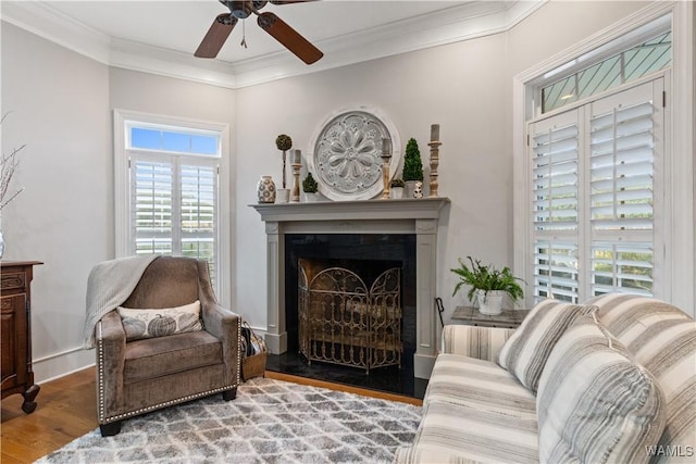 3610 Harbor Ridge Way, Tuscaloosa, AL 35406 - living area featuring wood finished floors, ornamental molding, ceiling fan, and a fireplace with raised hearth