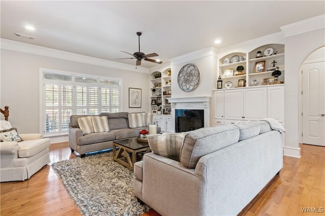 3610 Harbor Ridge Way, Tuscaloosa, AL 35406 - living area with a fireplace, crown molding, ceiling fan, light wood-style floors, and recessed lighting