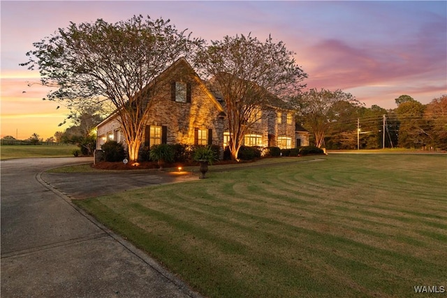 3610 Harbor Ridge Way, Tuscaloosa, AL 35406 - view of front facade with a lawn, stone siding, and driveway