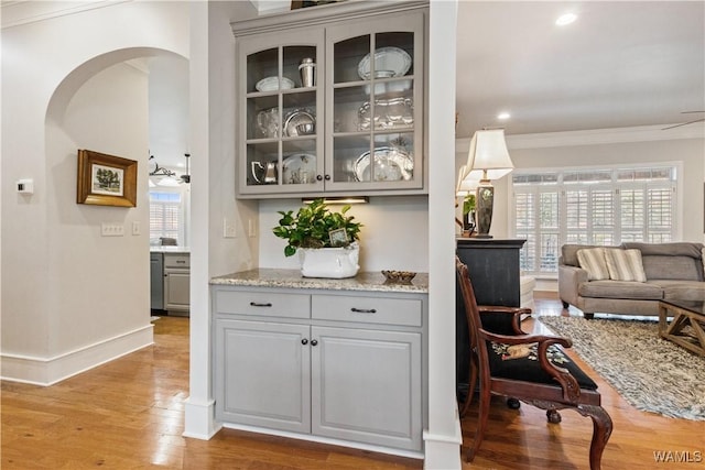 3610 Harbor Ridge Way, Tuscaloosa, AL 35406 - bar featuring arched walkways, light wood-style flooring, ornamental molding, baseboards, and recessed lighting