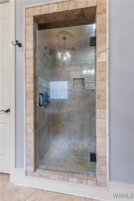 3610 Harbor Ridge Way, Tuscaloosa, AL 35406 - bathroom with a stall shower and a chandelier