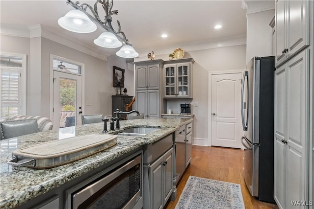 3610 Harbor Ridge Way, Tuscaloosa, AL 35406 - kitchen featuring appliances with stainless steel finishes, gray cabinets, a sink, glass insert cabinets, and crown molding