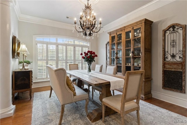 3610 Harbor Ridge Way, Tuscaloosa, AL 35406 - dining space with a chandelier, wood finished floors, ornamental molding, and baseboards