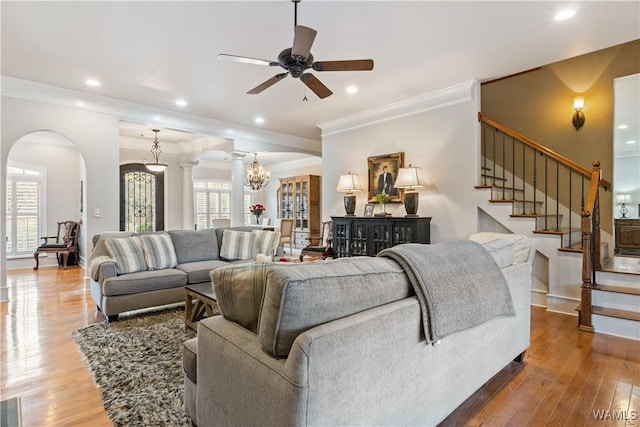 3610 Harbor Ridge Way, Tuscaloosa, AL 35406 - living area featuring arched walkways, a chandelier, crown molding, a ceiling fan, and wood-type flooring